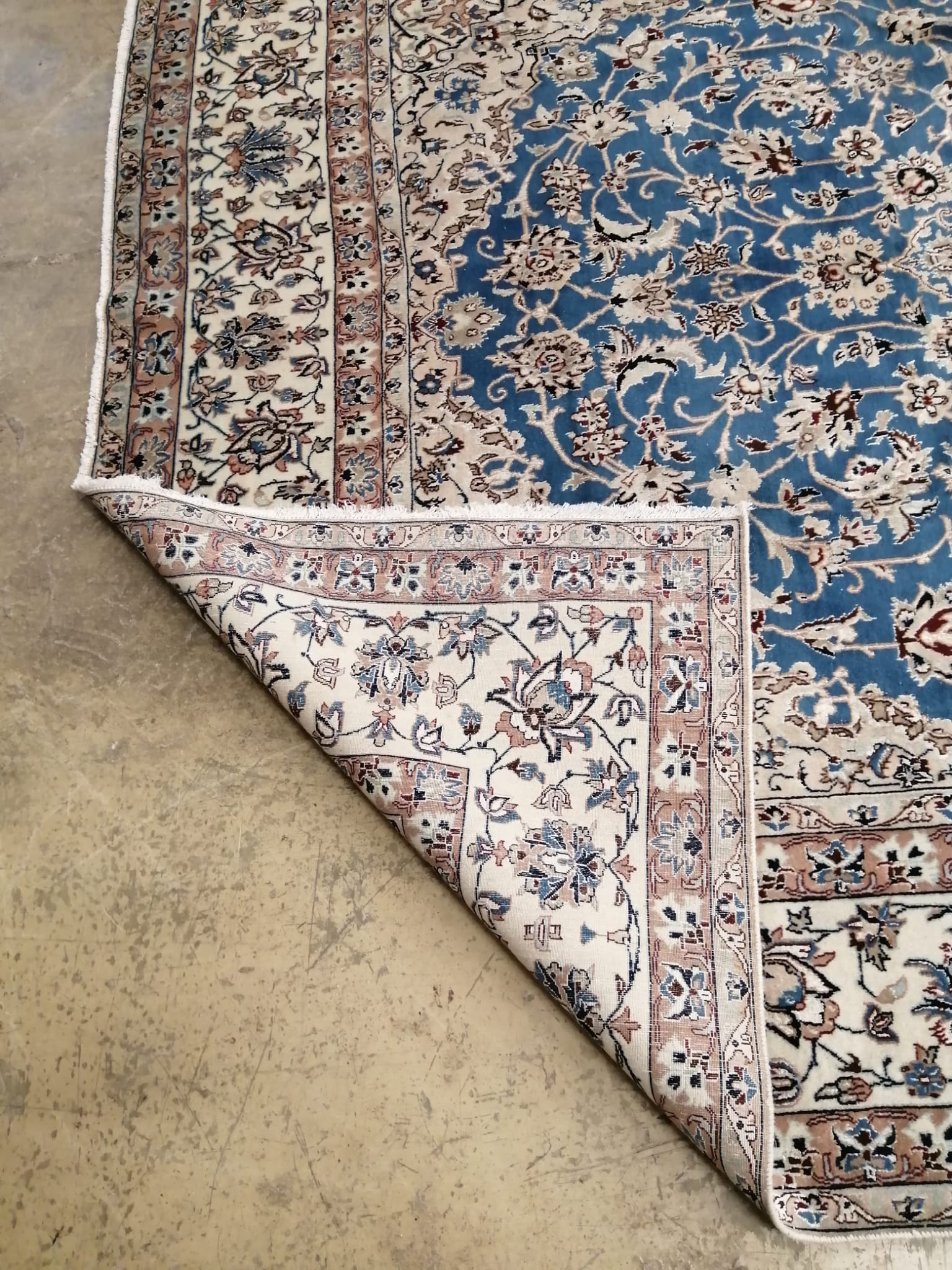 A Nain blue ground carpet, 355 x 215cm